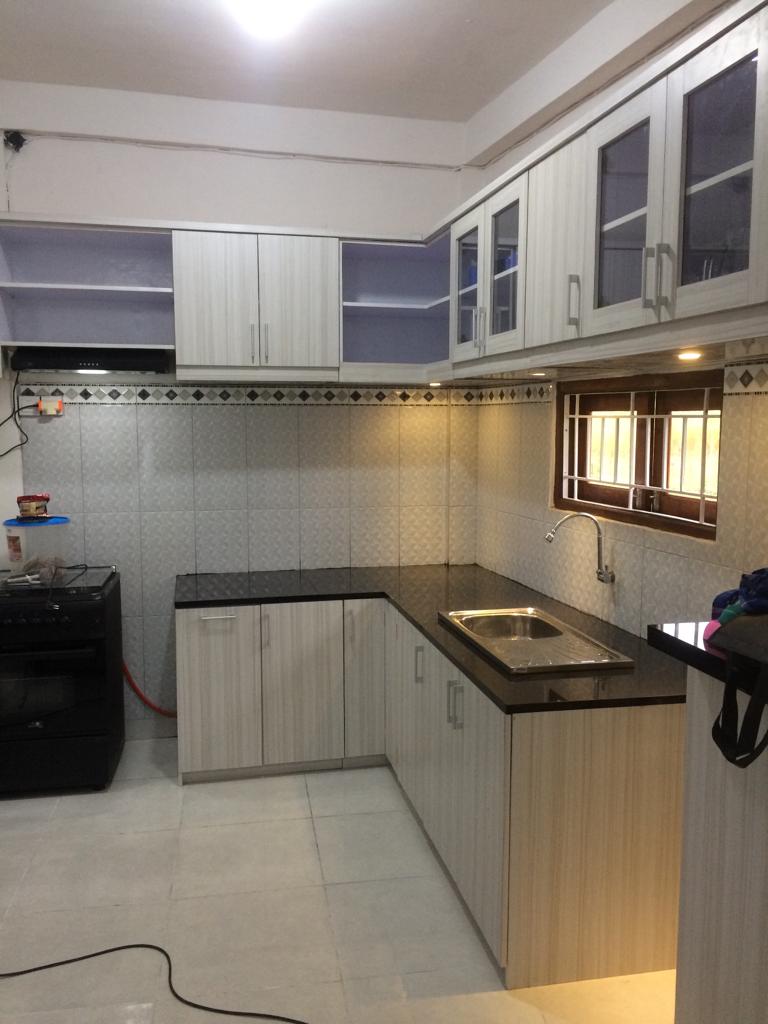 Artisan craftsman working on wooden table in workshop